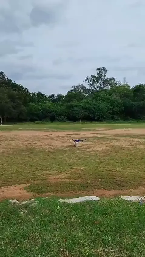 Ammunition Dropping Drone flying over a grass field