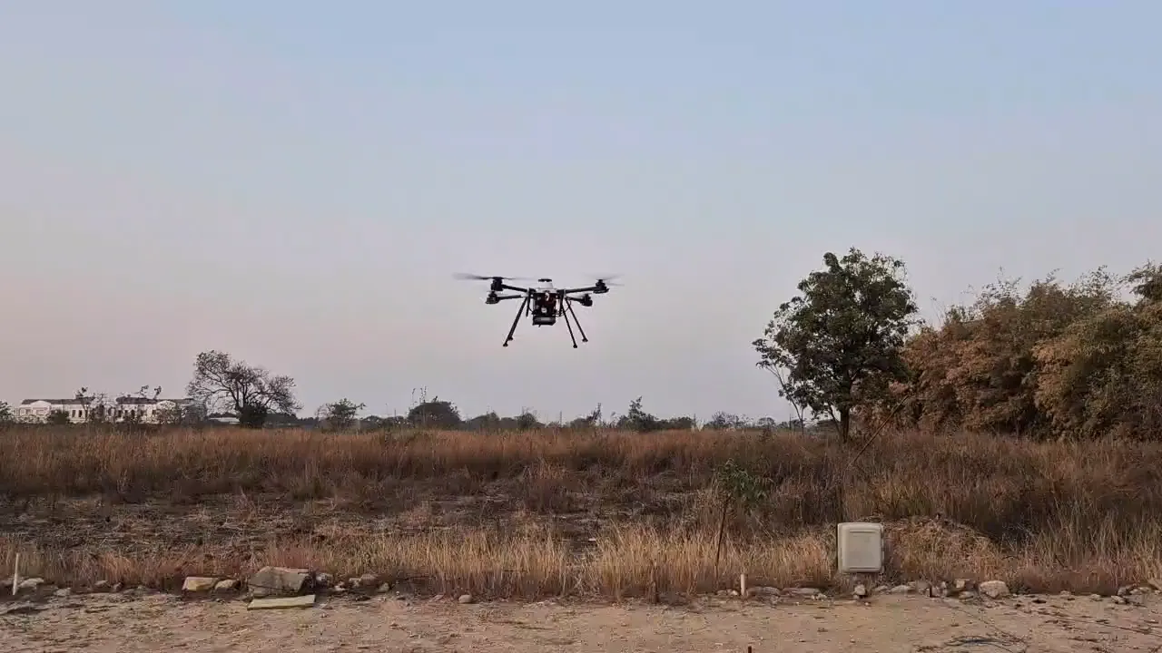Cellular drone in flight over scrubland