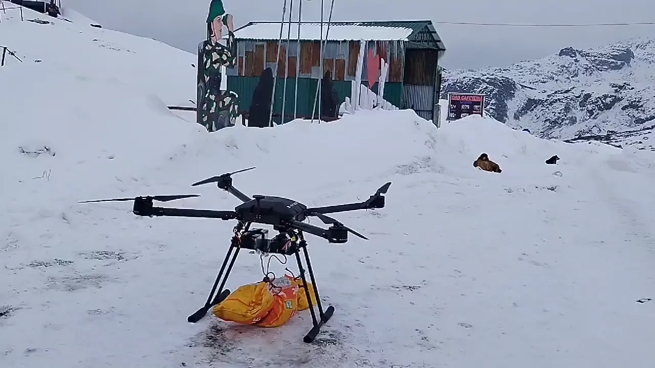 Very High Altitude Drone carrying a supply bag in snow at a mountain post