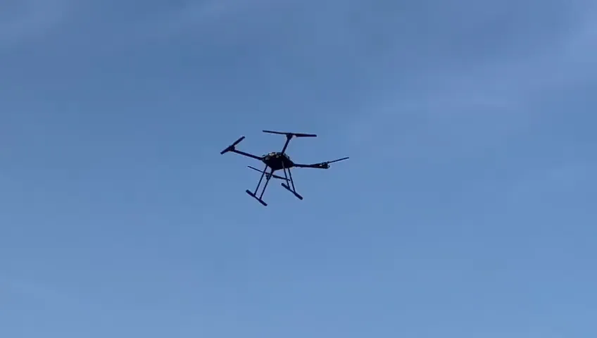 X4-10A drone in flight against a blue sky